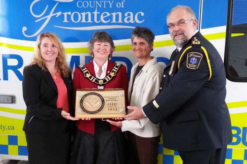  left to right: Tammie Shatraw, Wemp & Smith; Warden Janet Gutowski, County of Frontenac; Mikaela Hughes, Hughes Downey; Chief Paul Charbonneau, Frontenac Paramedic Services, with the LEED Gold Certification Plaque.